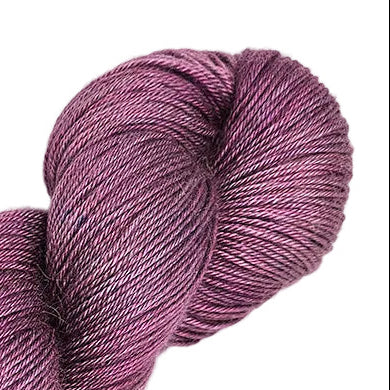 A skein of purple yarn labeled 'Sunset Fiber Co' on a white background.