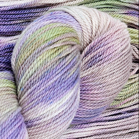 A skein of multicolored yarn in purple, green, and beige variegated shades.