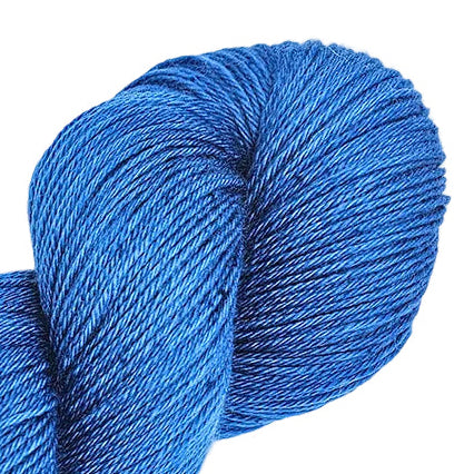 A skein of blue yarn laid out on a white background, showing a solid color yarn with a slight sheen.